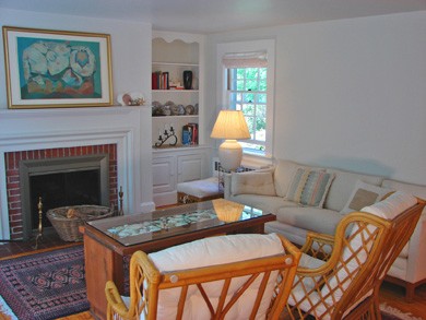 The living room with fireplace, cable TV, DVD and garden views in Barnstable, Cummaquid Mid Cape Cod