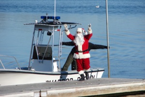 Santa arrives by boat during Christmas in Orleans, Cape Cod